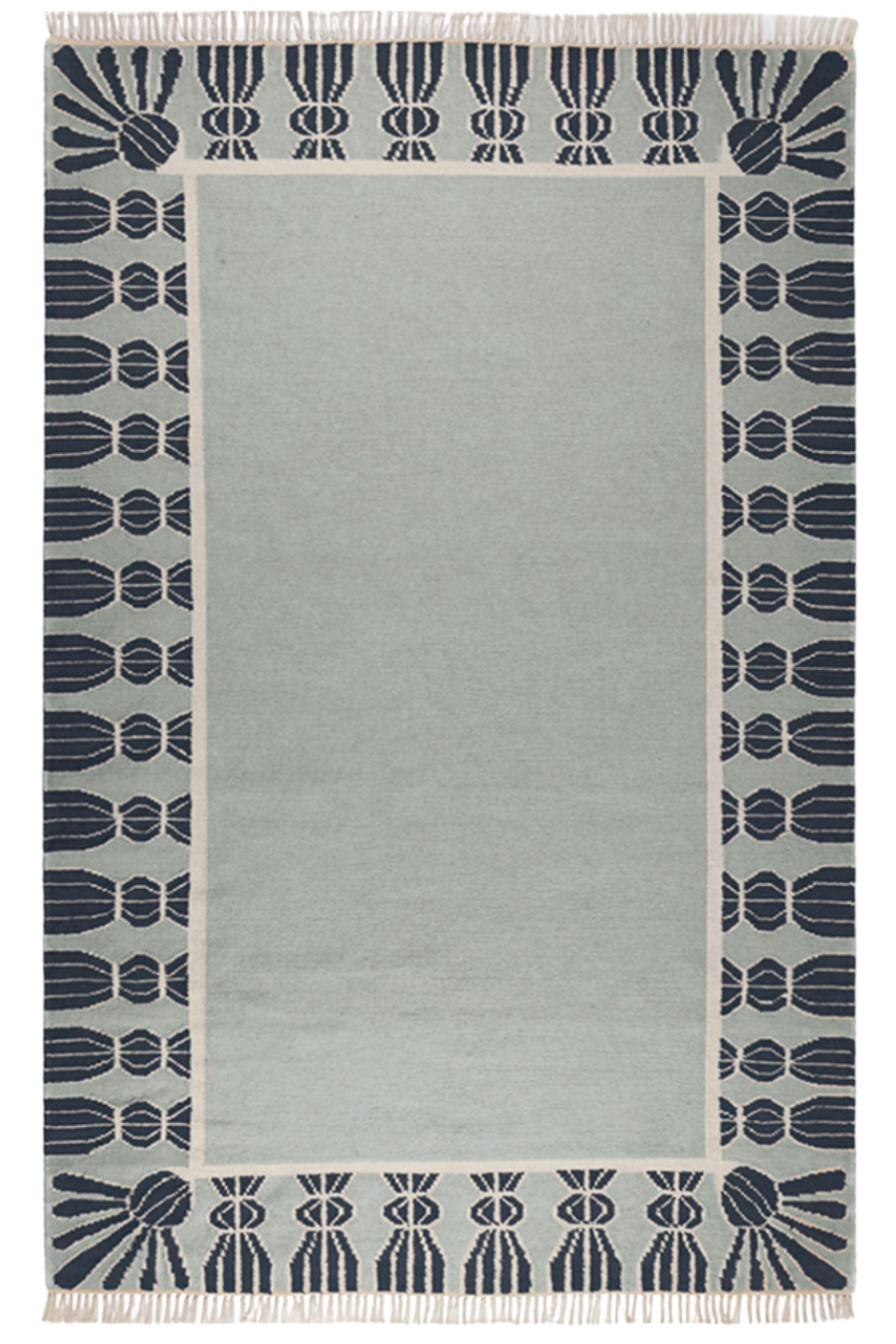 Wool rug in Sky Blue, Navy and Eggshell.
