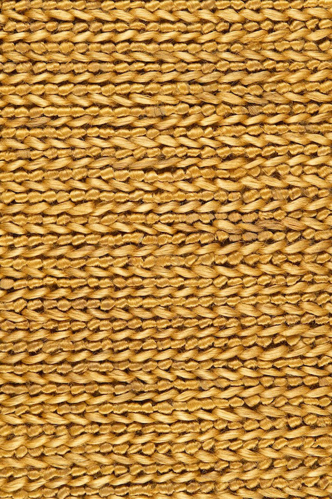 Handwoven jute rug in Mustard by Part & Parcel Goods